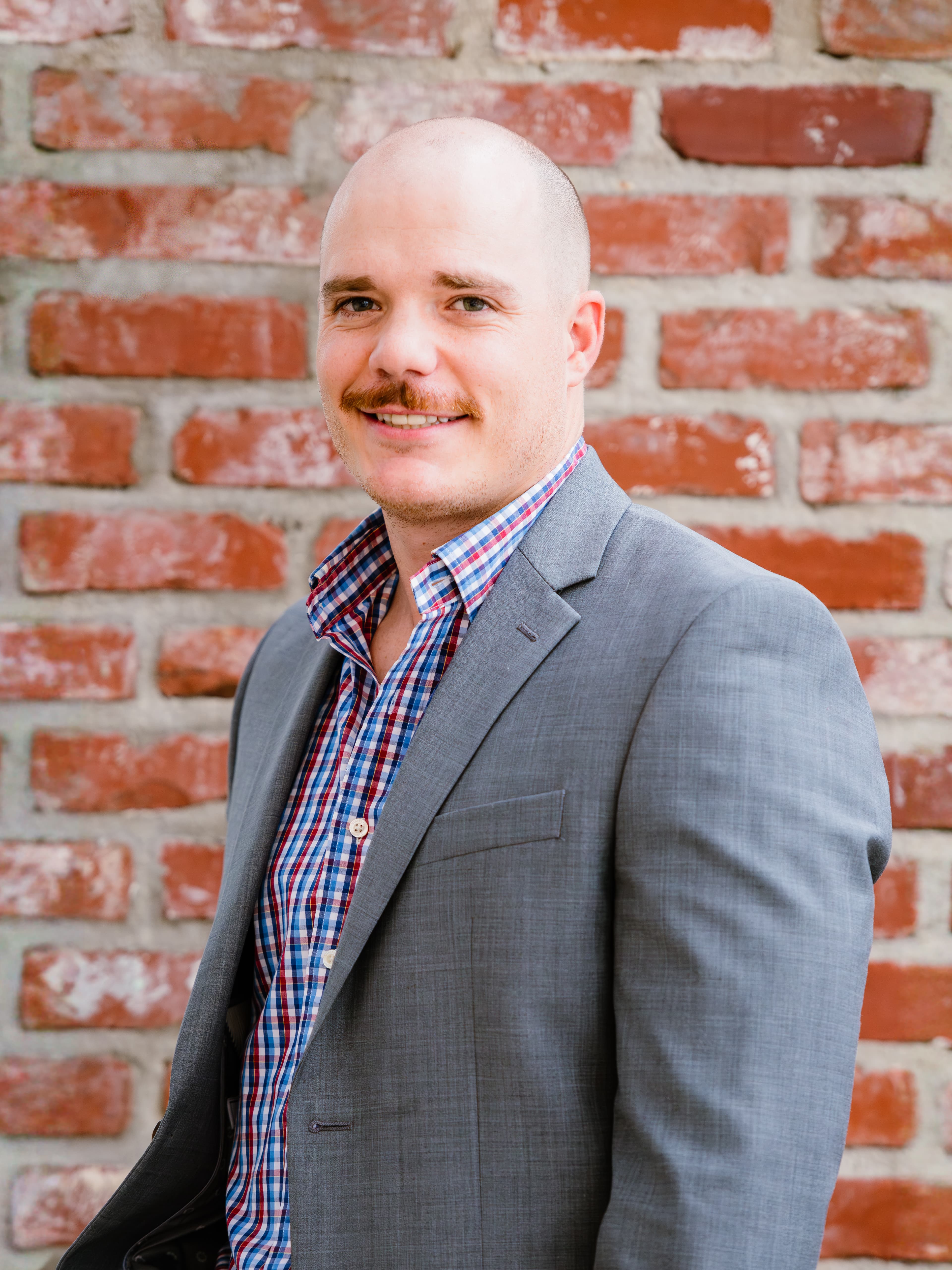 Headshot of Dylan Guledge, Assistant Project Manager/Estimating at McInnis Construction LLC
