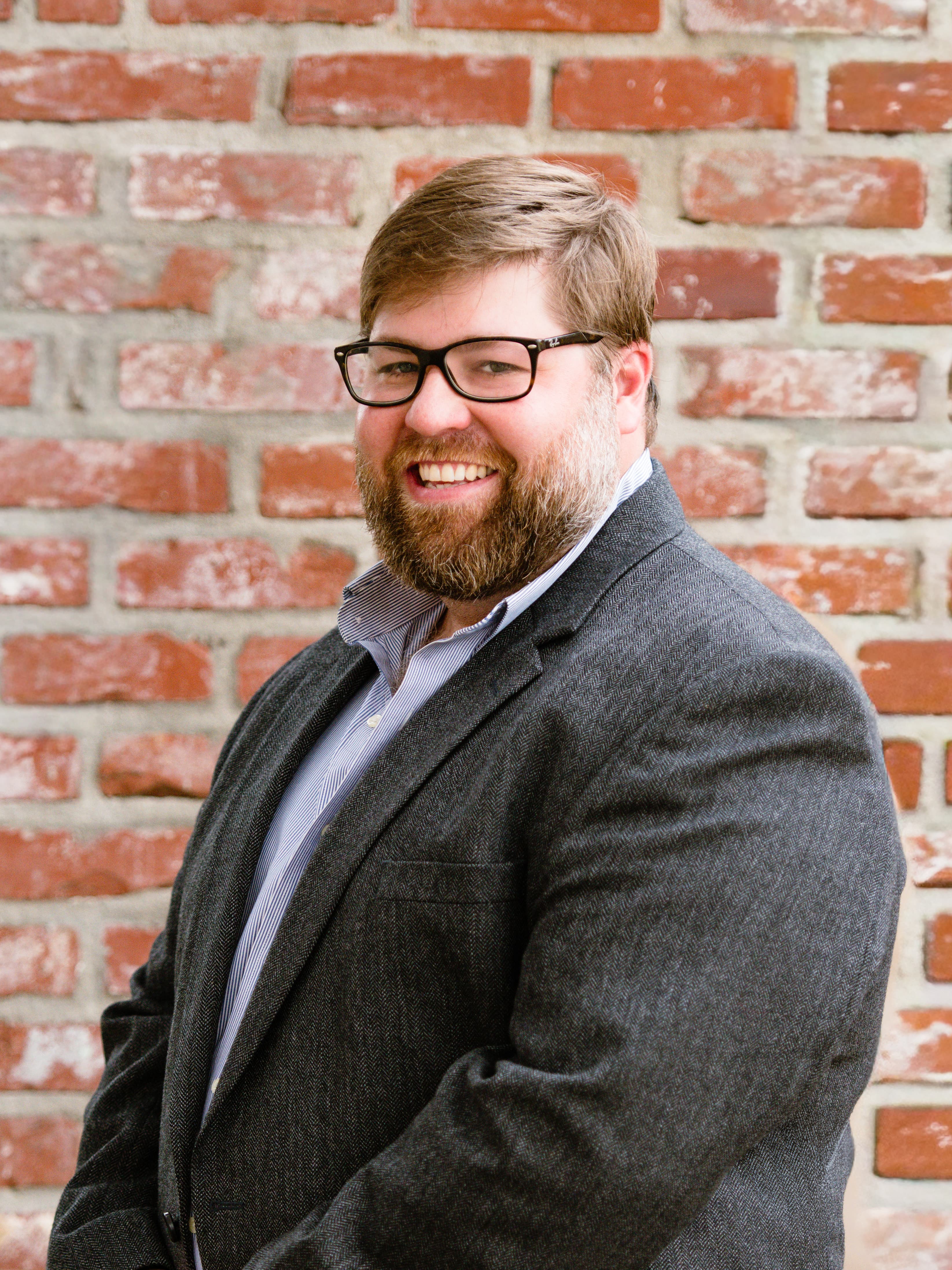 Headshot of Junnie Ellis, VP of Project Management at McInnis Construction LLC
