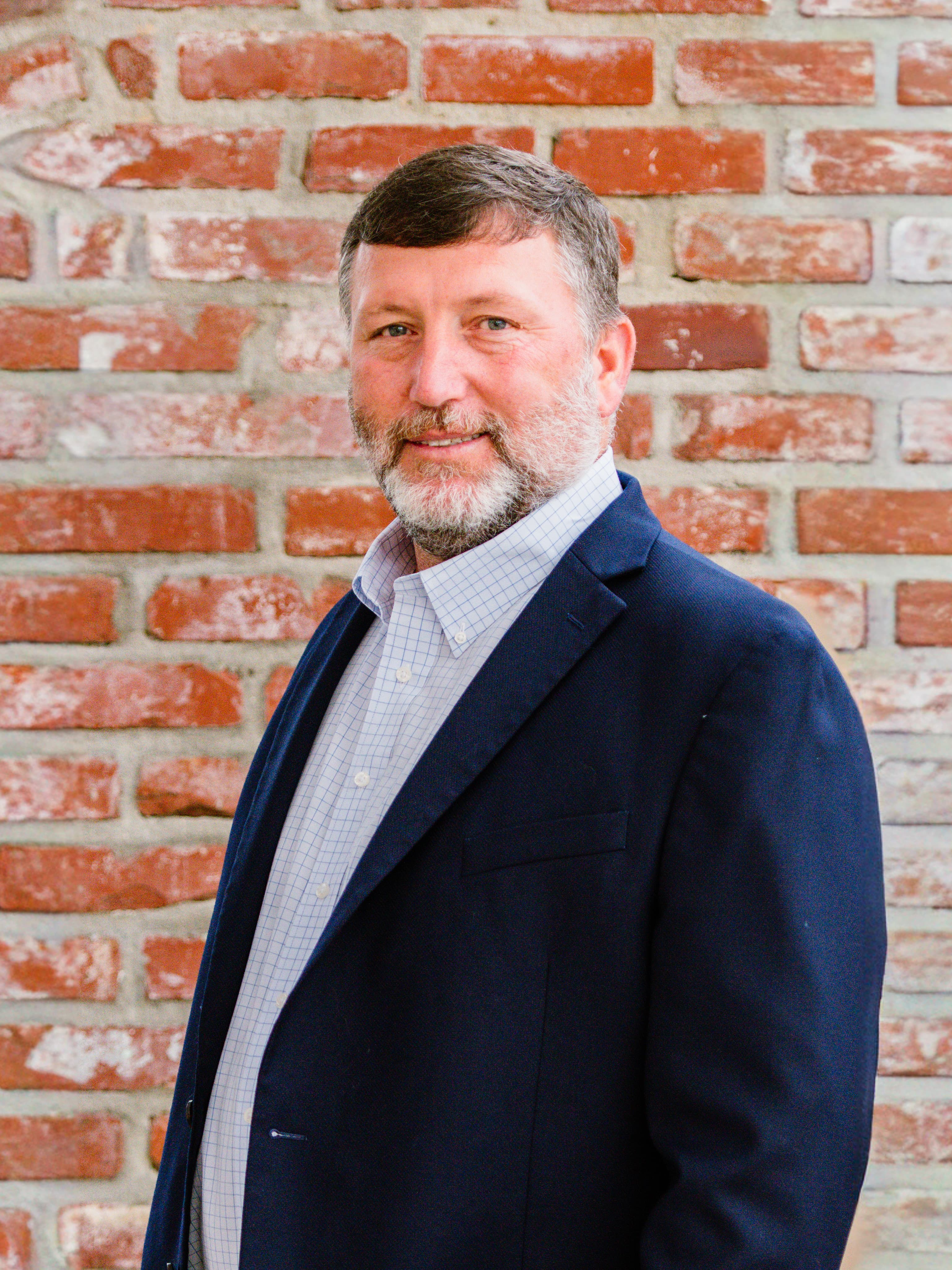 Headshot of Travis Tyler, COO at McInnis Construction LLC